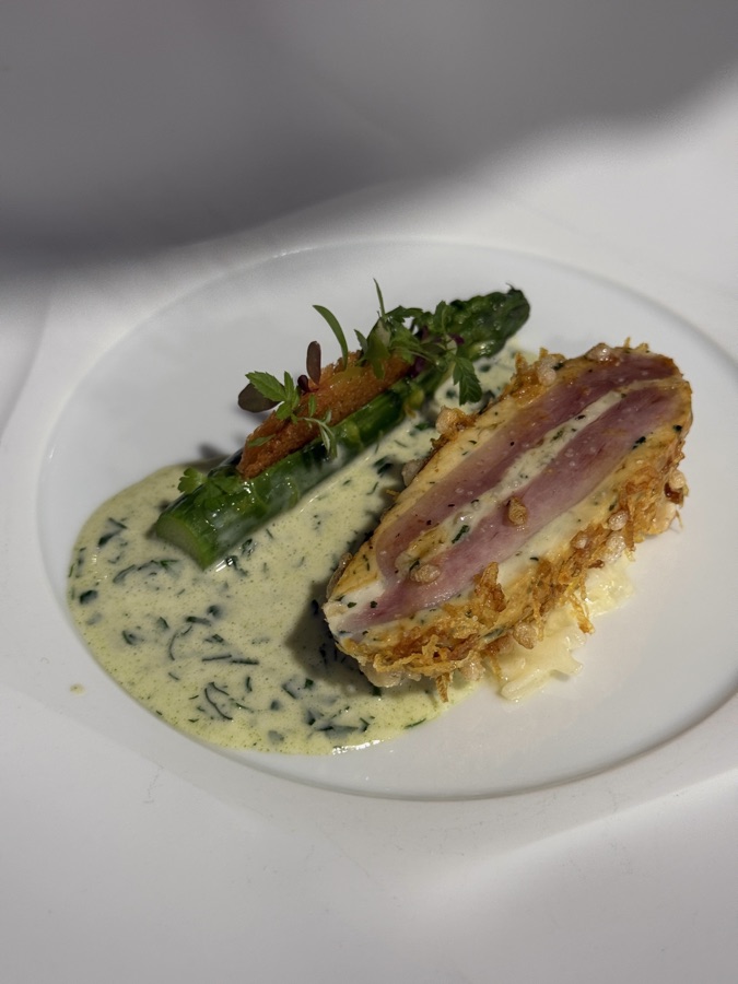 Plated fish course with asparagus and herb sauce from the twelve course menu at Restaurant Lakeside, Hotel The Fontenay