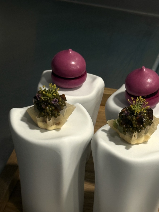 Two glazed desserts with caviar on white pedestals at Restaurant Lakeside, Hotel The Fontenay